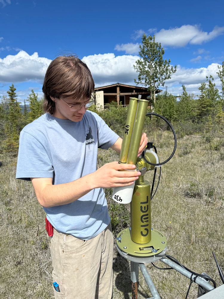 student working on the sun photometer